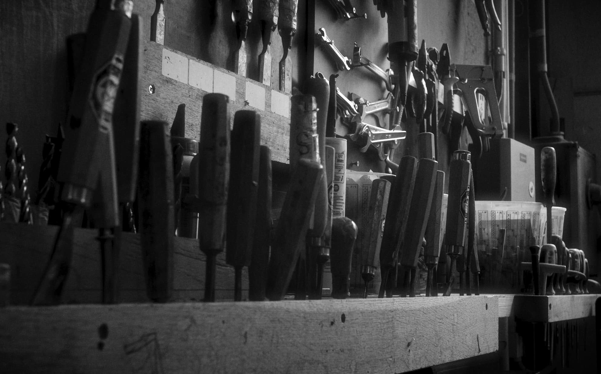 Black and white image of a workbench in the workshop of Heerenhuis